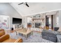 Inviting living room with vaulted ceilings, a brick fireplace, and an open layout at 101 Plantation Dr, Summerville, SC 29485