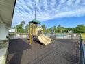 Community playground near the pool with a slide and climbing features for children at 127 Longford Dr, Summerville, SC 29483
