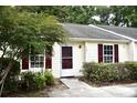 Inviting home exterior featuring a well-manicured lawn and charming architectural details at 1341 Pinnacle Ln, Charleston, SC 29412