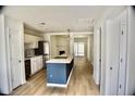 Open-concept kitchen with stainless steel appliances, a central island, and modern finishes at 1341 Pinnacle Ln, Charleston, SC 29412