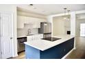 Modern kitchen featuring stainless steel appliances, white cabinets, and a stylish center island at 1341 Pinnacle Ln, Charleston, SC 29412