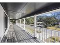 Inviting balcony featuring a classic white railing and ample space for seating to enjoy neighborhood views at 1520 Acacia St, Charleston, SC 29407