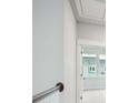 Hallway leading to a bedroom, showing the rail and a window with a neighborhood view at 211 Yalton St, Summerville, SC 29486