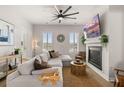 Bright living room with comfortable seating, modern fireplace, and large windows at 226 Midtown Ave, Summerville, SC 29486