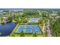 Overhead view of community amenities including pool, tennis courts, and scenic pond at 2269 Hartfords Bluff Cir, Mount Pleasant, SC 29466