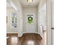 Bright foyer with hardwood floors, a view of the front door, and adjacent rooms for easy access at 243 Old Savannah Dr, Goose Creek, SC 29445