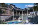 Stunning backyard with a private pool, lounge chairs, and well-maintained landscaping at 27 Rebellion Rd, Charleston, SC 29407