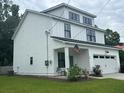 Charming, modern farmhouse with a two-car garage and professionally landscaped yard at 31 Wedgepark Rd, Charleston, SC 29407