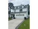 Charming, modern farmhouse with a two-car garage and professionally landscaped yard at 31 Wedgepark Rd, Charleston, SC 29407