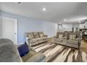 Cozy living room with neutral-toned sofas, a patterned rug, and plenty of space for relaxation at 386 Spruce Ivy St, Moncks Corner, SC 29461