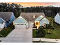 Aerial view showcasing the property's well-manicured lawn, driveway, and landscaping features at 467 Hidden Meadow Ln, Summerville, SC 29486