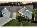 Stunning exterior view of a well-maintained home with a spacious driveway and beautiful landscaping at 467 Hidden Meadow Ln, Summerville, SC 29486