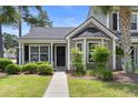 Charming townhome with a well-manicured front yard and inviting entrance at 4801 Shady Tree Ln, Summerville, SC 29485