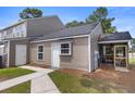 Rear exterior of a home with a door and window that leads to the yard at 4801 Shady Tree Ln, Summerville, SC 29485