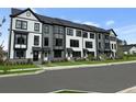 New townhome construction showcases modern exterior with black window frames and gray accents at 562 Scholar Way, Summerville, SC 29486