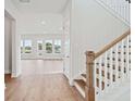 Bright entryway with hardwood floors, leading to a naturally lit living area with many windows at 78 French Garden Cir, Summerville, SC 29486