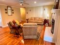 Relaxing living room with hardwood floors, fireplace, neutral walls, ceiling fan, and cozy furniture at 946 Law Ln, Mount Pleasant, SC 29464