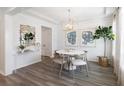 Bright dining area featuring shiplap walls, stylish mirror, and contemporary chandelier at 1034 Scotch Bonnet Way, Summerville, SC 29485