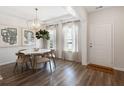 Bright dining area boasts shiplap walls, modern lighting, and large windows at 1034 Scotch Bonnet Way, Summerville, SC 29485