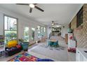 Bright sun room with lots of natural light and backyard access, perfect for entertaining at 1039 Grand Concourse St, Charleston, SC 29412