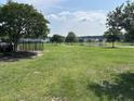 Expansive green space with a pond and mature trees offers a serene setting at 107 Brookhaven Rd, Summerville, SC 29486