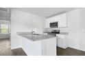 Kitchen featuring granite countertops, stainless steel appliances, and white cabinetry at 123 Mims Academy Dr, Harleyville, SC 29448