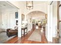 Bright entryway boasting hardwood floors, white trim, and an open concept to the living spaces at 158 Mary Ellen Dr, Charleston, SC 29403