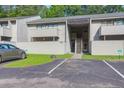 Exterior of condo with assigned parking and steps leading to the front door at 202 Waterwood Dr, Goose Creek, SC 29445