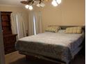 Comfortable bedroom with a large bed, dresser, and neutral decor at 204 Pete Ewers Dr, Summerville, SC 29483