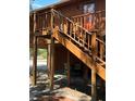 Exterior view of home with stairs, wooden support beams and outdoor space at 209 Jungle Rd, Edisto Beach, SC 29438