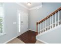 Entryway with hardwood floors, staircase, and neutral paint, creating a welcoming atmosphere at 228 Donatella Dr, Goose Creek, SC 29445