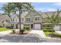 Charming townhouse complex with manicured lawns and mature trees at 230 Darcy Ave, Goose Creek, SC 29445