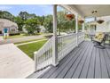 Inviting front porch with hanging flower baskets and neighborhood views at 3061 Penny Ln, Johns Island, SC 29455