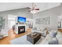 Bright living room featuring hardwood floors, fireplace, and an open layout at 3061 Penny Ln, Johns Island, SC 29455