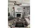 Elegant living room with fireplace, decorative shelves, and comfortable seating arrangement for entertaining at 307 Glen St, Summerville, SC 29483