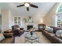 Open living room with vaulted ceilings, fireplace, dark floors, and comfortable seating at 332 Clayton Dr, Charleston, SC 29414