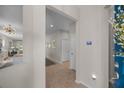 Bright entryway with tile flooring, neutral walls, and a view of the kitchen at 546 Sea Foam St, Summerville, SC 29486