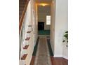 Hallway with carpet and view to living room with fireplace at 8522 Long Meadow Dr, Charleston, SC 29420