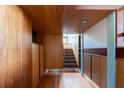Hallway with wood paneled walls and ceilings, offering a warm and inviting ambiance at 905 Palm Blvd, Isle of Palms, SC 29451
