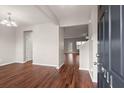 Welcoming foyer boasts gorgeous hardwood flooring, neutral paint, and open floor plan at 9711 Tackle St, Ladson, SC 29456