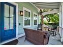 Inviting front porch with comfortable seating, a ceiling fan, and charming exterior details at 1076 Hatfield St, North Charleston, SC 29405