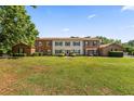 Spacious home with brick accents, a well-manicured lawn, and attractive landscaping at 108 Woodlake Dr, Summerville, SC 29485