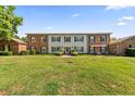 Spacious home with brick accents, a well-manicured lawn, and attractive landscaping at 108 Woodlake Dr, Summerville, SC 29485