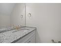 Modern powder room featuring granite countertop, white vanity, and brushed gold hardware at 112 Shingle Oak Dr, Moncks Corner, SC 29461
