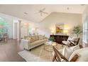 Bright and airy living room with vaulted ceilings, hardwood floors, and plenty of natural light at 1148 Black Rush Cir, Mount Pleasant, SC 29466