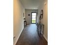 Inviting entryway with wood floors, console table, and decorative mirror creating a welcoming atmosphere at 116 Gaura Ln, Summerville, SC 29483
