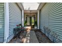 Inviting front entrance with double doors and a decorative hanging light fixture at 1231 Wild Olive Dr, Mount Pleasant, SC 29464