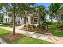 Charming home featuring a welcoming porch and colorful, well-maintained landscaping enhancing its curb appeal at 1363 Rivella Dr, Mount Pleasant, SC 29464
