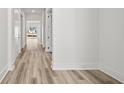 Hallway with wood floors and white trim at 137 Summerwind Dr, Summerville, SC 29486
