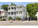 Charming two-story home with double porches and well-maintained landscaping at 142 President St, Charleston, SC 29403